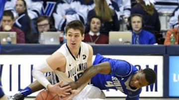 Feb 16, 2015; Villanova, PA, USA; Villanova Wildcats guard Ryan Arcidiacono (15) and Seton Hall Pirates guard Sterling Gibbs (4) battle for loose ball during the second half at The Pavilion. The Wildcats defeated the Pirates, 80-54. Mandatory Credit: Eric Hartline-USA TODAY Sports