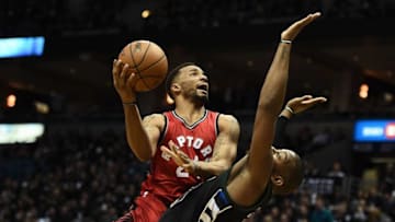 MILWAUKEE, WI - APRIL 20: Norman Powell #24 of the Toronto Raptors is fouled by Greg Monroe #15 of the Milwaukee Bucks during the second half of Game Three of the Eastern Conference Quarterfinals during the 2017 NBA Playoffs at the BMO Harris Bradley Center on April 20, 2017 in Milwaukee, Wisconsin. The Bucks defeated the Raptors 106-77. NOTE TO USER: User expressly acknowledges and agrees that, by downloading and or using this photograph, User is consenting to the terms and conditions of the Getty Images License Agreement. (Photo by Stacy Revere/Getty Images)