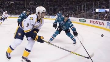 October 28, 2015; San Jose, CA, USA; Nashville Predators center Filip Forsberg (9) and San Jose Sharks right wing Joonas Donskoi (27) fight for the puck during the third period at SAP Center at San Jose. The Predators defeated the Sharks 2-1. Mandatory Credit: Kyle Terada-USA TODAY Sports