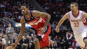 Feb 12, 2014; Houston, TX, USA; Washington Wizards small forward Trevor Ariza (1) drives the ball during the fourth quarter as Houston Rockets shooting guard Francisco Garcia (32) defends at Toyota Center. The Rockets defeated the Wizards 113-112. Mandatory Credit: Troy Taormina-USA TODAY Sports