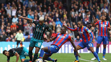 LONDON, ENGLAND - SEPTEMBER 16: Christian Benteke of Crystal Palace tackles Mario Lemina of Southampton during the Premier League match between Crystal Palace and Southampton at Selhurst Park on September 16, 2017 in London, England. (Photo by Dan Istitene/Getty Images)