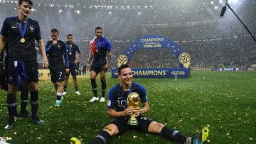 France's forward Florian Thauvin holds the World Cup trophy (FRANCK FIFE/AFP via Getty Images)