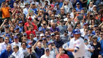 Apr 17, 2015; Chicago, IL, USA; Fans take photos with their cell phones and cameras as Chicago Cubs infielder Kris Bryant comes up to bat during the first inning against the San Diego Padres at Wrigley Field. Mandatory Credit: Jerry Lai-USA TODAY Sports