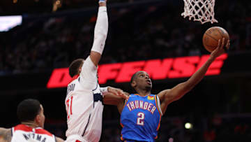 Shai Gilgeous-Alexander #2 of the Oklahoma City Thunder shoots in front in front of Daniel Gafford #21 of the Washington Wizards during the first half at Capital One Arena on January 11, 2022 in Washington, DC. NOTE TO USER: User expressly acknowledges and agrees that, by downloading and or using this photograph, User is consenting to the terms and conditions of the Getty Images License Agreement. (Photo by Patrick Smith/Getty Images)