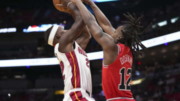 Ayo Dosunmu #12 of the Chicago Bulls attempts to block the a shot attempt by Jimmy Butler #22 of the Miami Heat(Photo by Eric Espada/Getty Images)