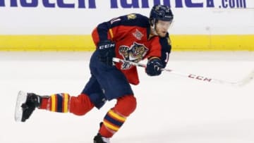 Jan 24, 2014; Sunrise, FL, USA; Florida Panthers center Jonathan Huberdeau (11) shoots the puck in the second period of a game against the Colorado Avalanche at BB&T Center. Mandatory Credit: Robert Mayer-USA TODAY Sports