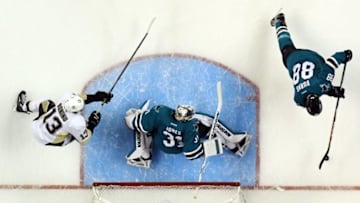 Jun 4, 2016; San Jose, CA, USA; San Jose Sharks defenseman Brent Burns (88) clears the puck away from goalie Martin Jones (31) and Pittsburgh Penguins center Nick Bonino (13) in game three of the 2016 Stanley Cup Final at SAP Center at San Jose. Mandatory Credit: Kyle Terada-USA TODAY Sports