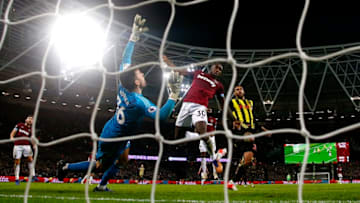 LONDON, ENGLAND - DECEMBER 22: Michail Antonio of West Ham United wins a header as Ben Foster of Watford dives to make a save during the Premier League match between West Ham United and Watford FC at London Stadium on December 22, 2018 in London, United Kingdom. (Photo by Christopher Lee/Getty Images)
