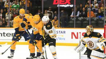 NASHVILLE, TN - JANUARY 07: Boston Bruins defenseman Matt Grzelcyk (48) defends against Nashville Predators center Yakov Trenin (32), of Russia, during the NHL game between the Nashville Predators and Boston Bruins, held on January 7, 2020, at Bridgestone Arena in Nashville, Tennessee. (Photo by Danny Murphy/Icon Sportswire via Getty Images)