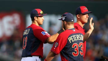 Jul 13, 2014; Minneapolis, MN, USA; USA player Joey Gallo (left) celebrates with his teammates after defeating the World during the All Star Futures Game at Target Field. Mandatory Credit: Jerry Lai-USA TODAY Sports