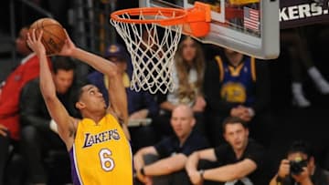 April 13, 2016; Los Angeles, CA, USA; Los Angeles Lakers guard Jordan Clarkson (6) dunks to score a basket against Utah Jazz during the second half at Staples Center. Mandatory Credit: Gary A. Vasquez-USA TODAY Sports