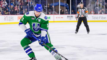 LAVAL, QC - NOVEMBER 25: Utica Comets defenseman Philip Holm (52) skates with the puck during the first period of the AHL game between the Utica Comets and the Laval Rocket on November 25, 2017, at the Place Bell in Laval, QC (Photo by Vincent Ethier/Icon Sportswire via Getty Images)