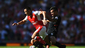 LONDON, ENGLAND - AUGUST 14: Alexis Sanchez of Arsenal is tackled by Dejan Lovren of Liverpool during the Premier League match between Arsenal and Liverpool at Emirates Stadium on August 14, 2016 in London, England. (Photo by Michael Regan/Getty Images)
