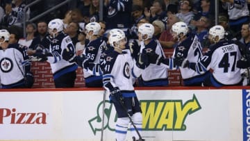 Oct 3, 2016; Winnipeg, Manitoba, CAN; Winnipeg Jets forward Kyle Connor (41) celebrates after scoring his third goal of the preseason during the third period against the Ottawa Senators at MTS Centre. Winnipeg wins 4-2. Mandatory Credit: Bruce Fedyck-USA TODAY Sports