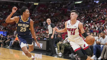 Tyler Herro #14 of the Miami Heat drives to the basket while being defended by Trey Murphy III #25 of the New Orleans Pelicans(Photo by Eric Espada/Getty Images)
