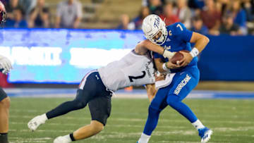Cincinnati Bearcats linebacker Wilson Huber sacks Tulsa Golden Hurricane quarterback Davis Brin. USA Today.