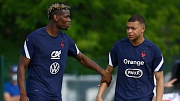 France's midfielder Paul Pogba speaks with France's forward Kylian Mbappe (R). (Photo by FRANCK FIFE/AFP via Getty Images)
