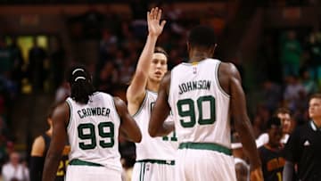 Nov 13, 2015; Boston, MA, USA; Boston Celtics center Kelly Olynyk (center) celebrates with forward Jae Crowder (99) and forward Amir Johnson (90) during the second half of a game against the Atlanta Hawks at TD Garden. Mandatory Credit: Mark L. Baer-USA TODAY Sports