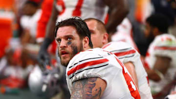 Jan 1, 2016; Glendale, AZ, USA; Ohio State Buckeyes offensive lineman Taylor Decker on the bench against the Notre Dame Fighting Irish during the 2016 Fiesta Bowl at University of Phoenix Stadium. The Buckeyes defeated the Fighting Irish 44-28. Mandatory Credit: Mark J. Rebilas-USA TODAY Sports