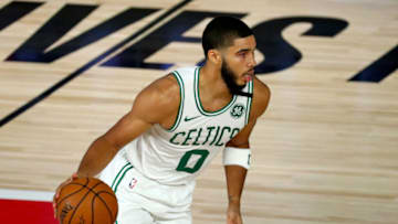 Former Duke basketball standout Jayson Tatum dribbles against the Philadelphia 76ers. (Photo by Kim Klement - Pool/Getty Images)