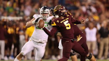 TEMPE, AZ - SEPTEMBER 23: Quarterback Manny Wilkins #5 of the Arizona State Sun Devils throws a pass under pressure from defensive lineman Henry Mondeaux #92 of the Oregon Ducks during the second half of the college football game at Sun Devil Stadium on September 23, 2017 in Tempe, Arizona. The Sun Devils defeated the Ducks 37-35. (Photo by Christian Petersen/Getty Images)