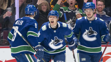 VANCOUVER, BC - APRIL 14: Alex Chiasson #39 of the Vancouver Canucks celebrates with teammates J.T. Miller #9 and Vasily Podkolzin #92 after scoring a goal against the Phoenix Coyotes during the first period at Rogers Arena on April 14, 2022in Vancouver, British Columbia, Canada. (Photo by Rich Lam/Getty Images)