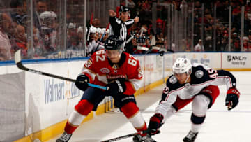 SUNRISE, FL - OCTOBER 11: Denis Malgin #62 of the Florida Panthers skates for possession against Lukas Sedlak #45 Columbus Blue Jackets at the BB&T Center on October 11, 2018 in Sunrise, Florida. (Photo by Eliot J. Schechter/NHLI via Getty Images)