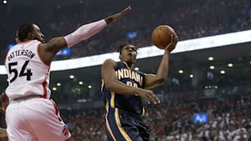 Apr 26, 2016; Toronto, Ontario, CAN; Indiana Pacers forward Myles Turner (33) drives to the basket as Toronto Raptors forward Patrick Patterson (54) tries to defend during the first quarter in game five of the first round of the 2016 NBA Playoffs at Air Canada Centre. Mandatory Credit: Nick Turchiaro-USA TODAY Sports