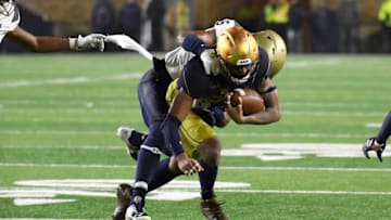 SOUTH BEND, IN - NOVEMBER 18: Notre Dame Fighting Irish wide receiver Kevin Stepherson (29) runs with the football and is tackled by Navy Midshipmen safety Sean Williams (6) during the college football game between the Notre Dame Fighting Irish and the Navy Midshipmen on November 18, 2017, at Notre Dame Stadium in South Bend, IN. (Photo by Robin Alam/Icon Sportswire via Getty Images)