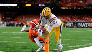 NEW ORLEANS, LOUISIANA - JANUARY 13: Thaddeus Moss #81 of the LSU Tigers scores a touchdown against the Clemson Tigers during the third quarter in the College Football Playoff National Championship game at Mercedes Benz Superdome on January 13, 2020 in New Orleans, Louisiana. (Photo by Jonathan Bachman/Getty Images)
