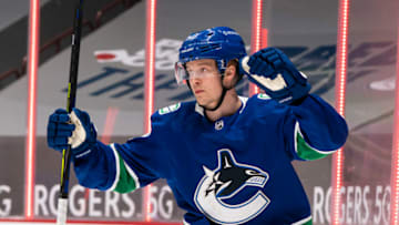 VANCOUVER, BC - JANUARY 27: Elias Pettersson #40 of the Vancouver Canucks celebrates a goal by teammate JT Miller's #9 against the Ottawa Senators during NHL hockey action at Rogers Arena on January 27, 2021 in Vancouver, Canada. (Photo by Rich Lam/Getty Images)