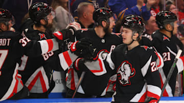 Mar 24, 2023; Buffalo, New York, USA; Buffalo Sabres right wing Jack Quinn (22) celebrates his goal with teammates during the first period against the New Jersey Devils at KeyBank Center. Mandatory Credit: Timothy T. Ludwig-USA TODAY Sports
