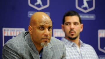 NEW YORK, NY - NOVEMBER 22: Tony Clark (L) and Carlos Villanueva listen as Major League Baseball Commissioner Bud Selig speaks at a news conference at MLB headquarters on November 22, 2011 in New York City. Selig announced a new five-year labor agreement between Major League Baseball and the Major League Baseball Players Association. (Photo by Patrick McDermott/Getty Images)