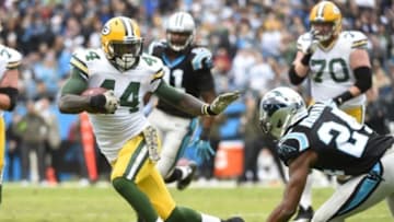 Nov 8, 2015; Charlotte, NC, USA; Green Bay Packers running back James Starks (44) runs as Carolina Panthers cornerback Josh Norman (24) defends in the first quarter at Bank of America Stadium. Mandatory Credit: Bob Donnan-USA TODAY Sports