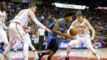 Dec 13, 2016; Atlanta, GA, USA; Orlando Magic guard Elfrid Payton (4) is defended by Atlanta Hawks forward Mike Muscala (31) and guard Kyle Korver (26) in the first quarter at Philips Arena. Mandatory Credit: Brett Davis-USA TODAY Sports