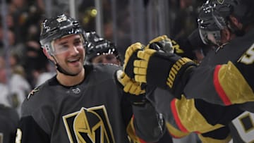 LAS VEGAS, NEVADA - FEBRUARY 20: Alec Martinez #23 of the Vegas Golden Knights celebrates with teammates on the bench after scoring a first-period goal against the Tampa Bay Lightning during their game at T-Mobile Arena on February 20, 2020 in Las Vegas, Nevada. (Photo by Ethan Miller/Getty Images)