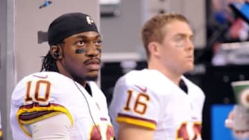 Nov 30, 2014; Indianapolis, IN, USA; Washington starting quarterback Colt McCoy (16) and back-up quarterback Robert Griffin III (10) during second half against the Indianapolis Colts at Lucas Oil Stadium. Mandatory Credit: Thomas J. Russo-USA TODAY Sports
