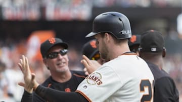 Oct 2, 2016; San Francisco, CA, USA; San Francisco Giants third baseman Conor Gillaspie (21) is congratulated by teammates during the second inning against the Los Angeles Dodgers at AT&T Park. Mandatory Credit: Neville E. Guard-USA TODAY Sports