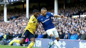 LIVERPOOL, ENGLAND - DECEMBER 21: Richarlison of Everton is challenged by Ainsley Maitland-Niles of Arsenal during the Premier League match between Everton FC and Arsenal FC at Goodison Park on December 21, 2019 in Liverpool, United Kingdom. (Photo by Jan Kruger/Getty Images)