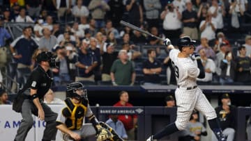 NEW YORK, NEW YORK - SEPTEMBER 20: Aaron Judge #99 of the New York Yankees hits his 60th home run of the season during the 9th inning of the game against the Pittsburgh Pirates at Yankee Stadium on September 20, 2022 in the Bronx borough of New York City. (Photo by Jamie Squire/Getty Images)