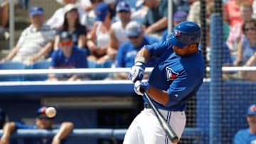 Mar 13, 2015; Dunedin, FL, USA; Toronto Blue Jays right fielder Chris Dickerson (33) hits a 2-RBI double during the second inning against the Baltimore Orioles at Florida Auto Exchange Park. Mandatory Credit: Kim Klement-USA TODAY Sports