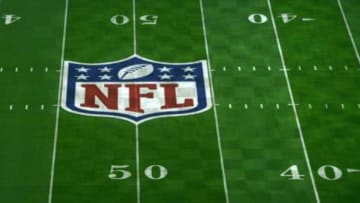 Jan 23, 2015; Glendale, AZ, USA; General view of NFL shield logo at midfield of University of Phoenix Stadium in advance of Super Bowl XLIX between the Seattle Seahawks and the New England Patriots. Mandatory Credit: Kirby Lee-USA TODAY Sports