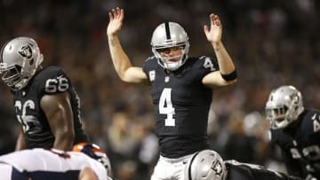 Nov 6, 2016; Oakland, CA, USA; Oakland Raiders quarterback Derek Carr (4) calls a play against the Denver Broncos in the second quarter at Oakland Coliseum. Mandatory Credit: Cary Edmondson-USA TODAY Sports