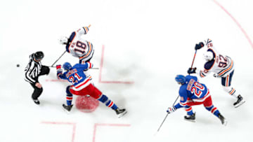 NEW YORK, NY - OCTOBER 12: Brett Howden #21 and Chris Kreider #20 of the New York Rangers battle for the puck against James Neal #18 and Tomas Jurco #92 of the Edmonton Oilers at Madison Square Garden on October 12, 2019 in New York City. (Photo by Jared Silber/NHLI via Getty Images)