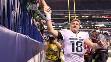 Dec 5, 2015; Indianapolis, IN, USA; Michigan State Spartans quarterback Connor Cook (18) greets fans after the game against the Iowa Hawkeyes in the Big Ten Conference football championship at Lucas Oil Stadium. Michigan State won 16-13. Mandatory Credit: Aaron Doster-USA TODAY Sports