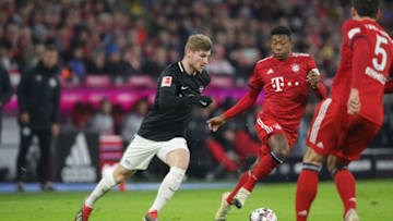 MUNICH, GERMANY - DECEMBER 19: Timo Werner (L) of Leipzig battles for the ball with David Alaba of Bayern Muenchen during the Bundesliga match between FC Bayern Muenchen and RB Leipzig at Allianz Arena on December 19, 2018 in Munich, Germany. (Photo by Alexander Hassenstein/Bongarts/Getty Images)