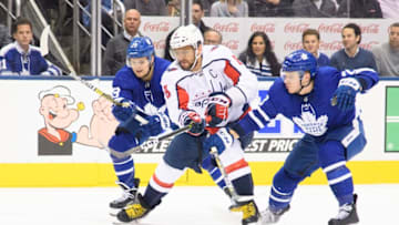 TORONTO, ON - JANUARY 23: Washington Capitals left wing Alex Ovechkin (8) battles for a puck between Toronto Maple Leafs right wing William Nylander (29) and Toronto Maple Leafs defenseman Travis Dermott (23) during the second period in a game between the Washington Capitals and the Toronto Maple Leafs at Scotiabank Arena in Toronto, Ontario Canada. The Toronto Maple Leafs won 6-3. (Photo by Nick Turchiaro/Icon Sportswire via Getty Images)