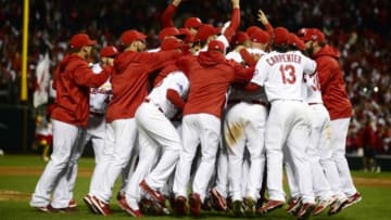 Oct 18, 2013; St. Louis, MO, USA; Members of the St. Louis Cardinals celebrate on the field after game six of the National League Championship Series baseball game against the Los Angeles Dodgers at Busch Stadium. Mandatory Credit: Jeff Curry-USA TODAY Sports