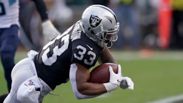 OAKLAND, CALIFORNIA - DECEMBER 08: DeAndre Washington #33 of the Oakland Raiders scores on a 14 yard touchdown run against the Tennessee Titans during the first half of an NFL football game at RingCentral Coliseum on December 08, 2019 in Oakland, California. (Photo by Thearon W. Henderson/Getty Images)