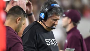 Oct 22, 2022; Tuscaloosa, Alabama, USA; Mississippi State Bulldogs head coach Mike Leach studies his play chart before calling a fourth down play against the Alabama Crimson Tide during the first half at Bryant-Denny Stadium. Mandatory Credit: Gary Cosby Jr.-USA TODAY Sports